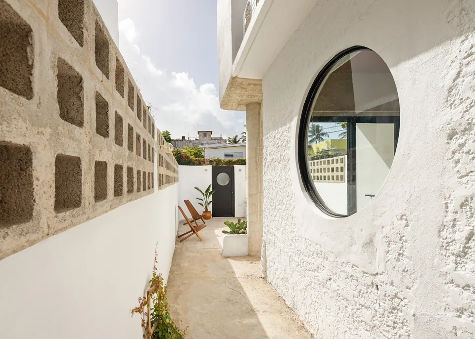 Private terrace beside a circular window at APT 3