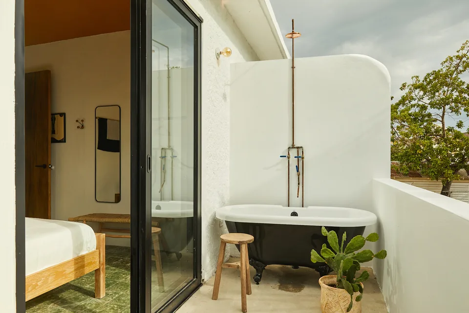 Private balcony with outdoor soaking tub at APT 7