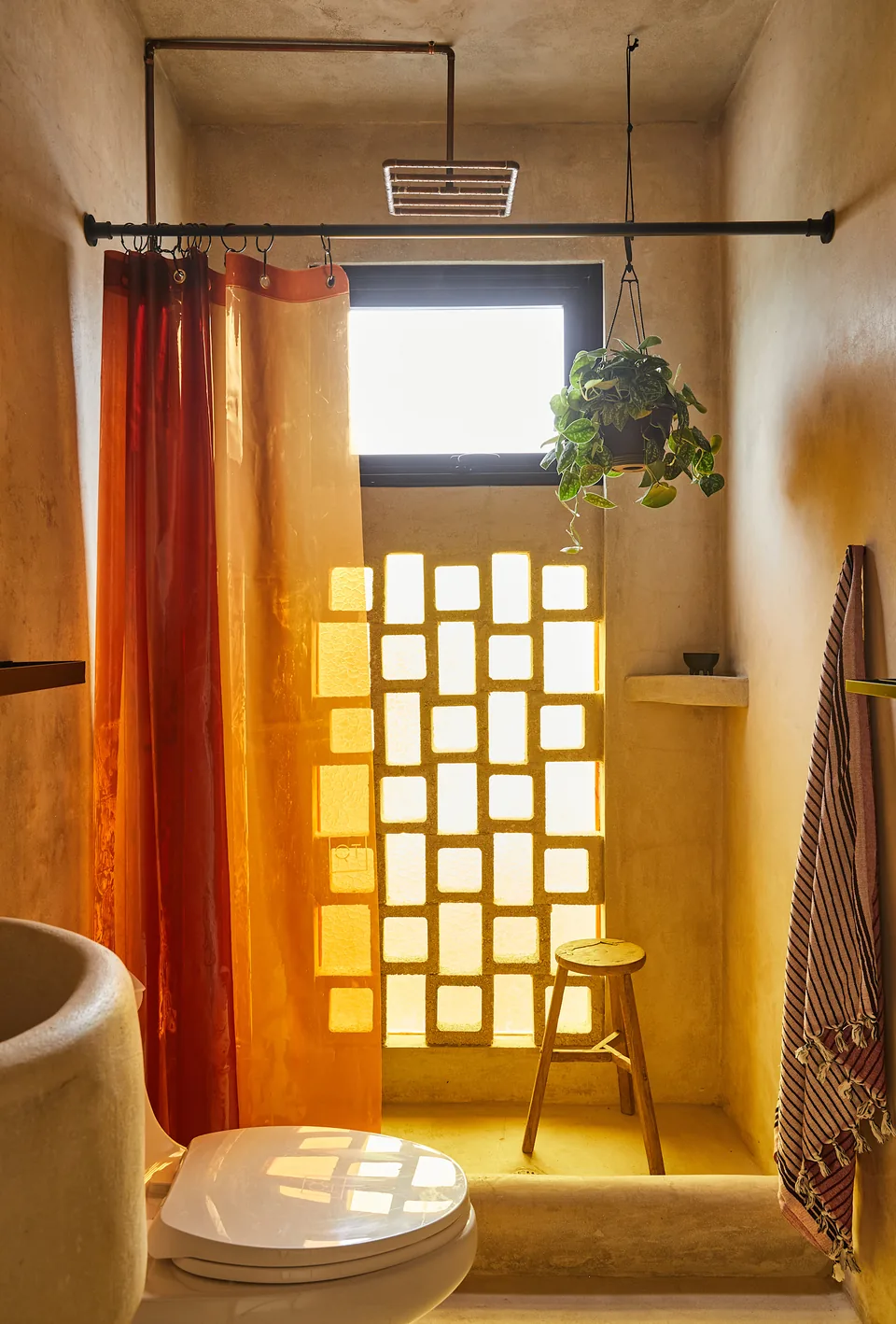 Sunlight through amber glass in an APT bathroom