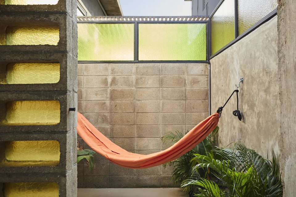An orange hammock and planted private patio at JA1