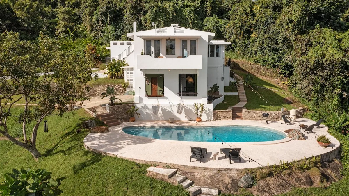 Wald Haus by DW from the air, the Dreamers Welcome house in Naguabo, with its pool and garden on the hillside.