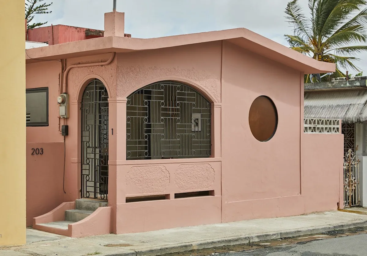 The pink street frontage of Rosa by DW, a Dreamers Welcome loft stay in Santurce, San Juan.