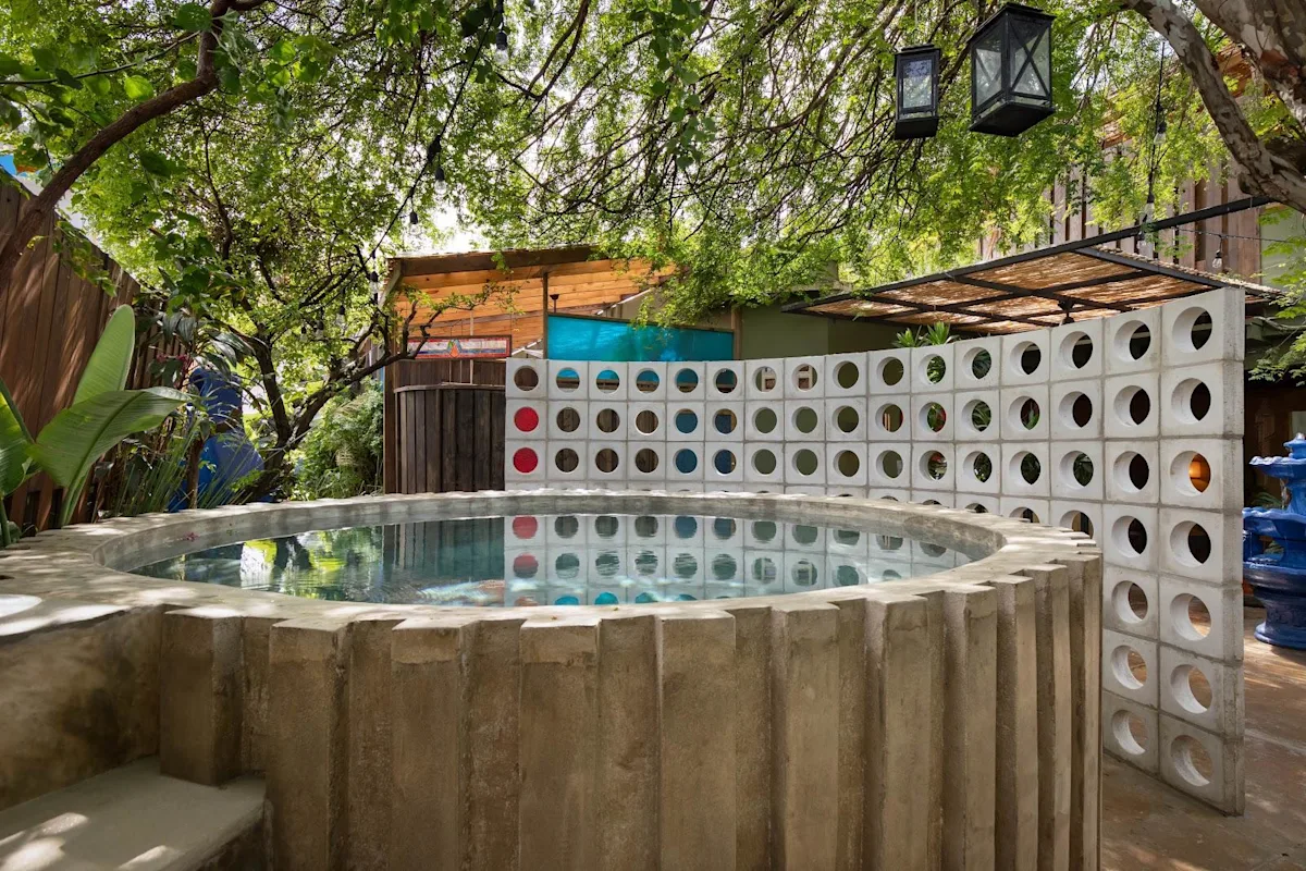 The pool and breeze-block wall at Dreamcatcher, the flagship boutique hotel of Dreamers Welcome, in Ocean Park, San Juan.
