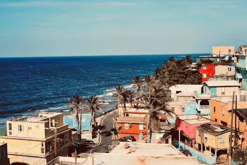 image of a view with a beach and houses.