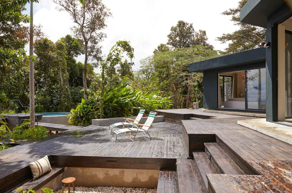 The deck, fire pit and saltwater pool at Selva by DW, the Dreamers Welcome rainforest house near Luquillo.