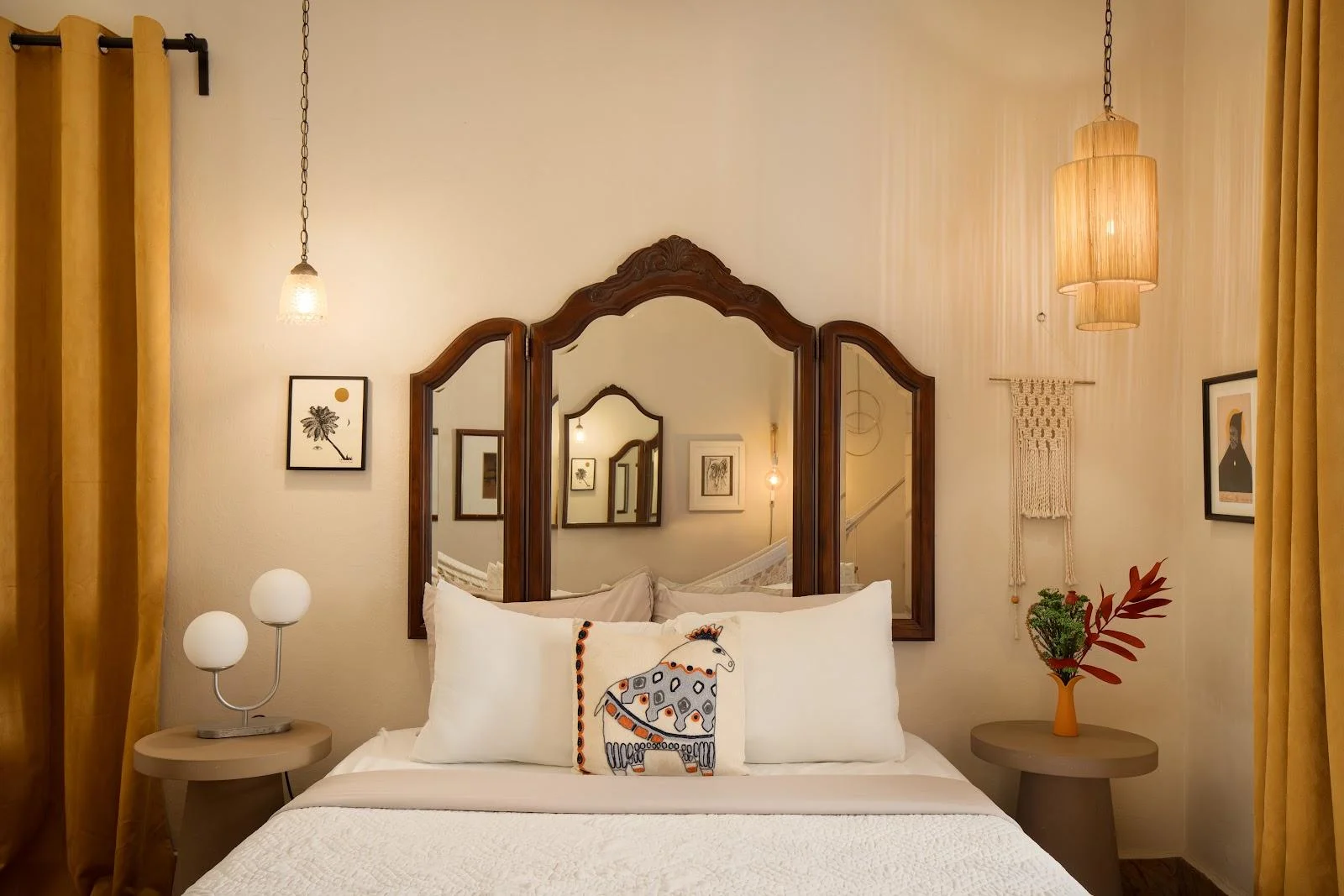 A guest room with an arched headboard at Dreamcatcher, the flagship boutique hotel of Dreamers Welcome in Ocean Park.