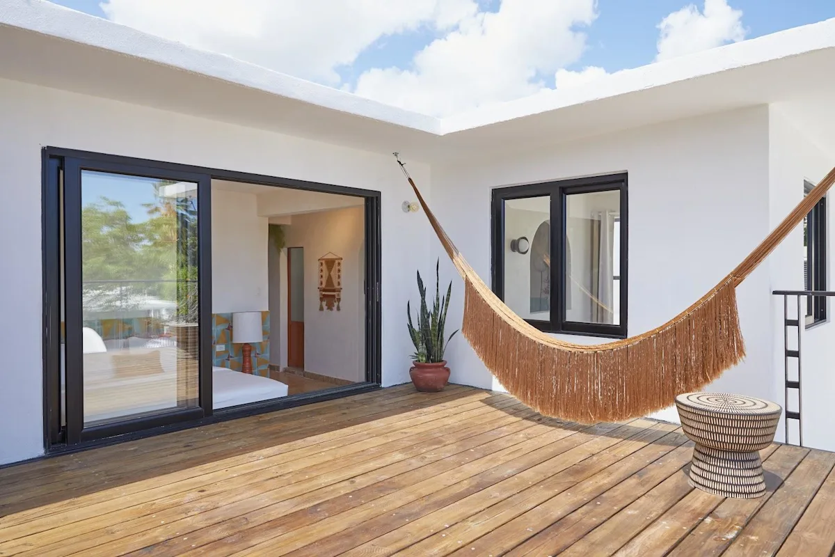 A hammock strung across the terrace of the Poet apartment at Duna by DW in San Juan.