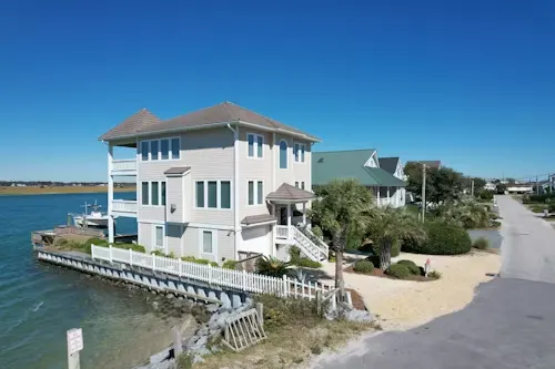 image of a white house on a dock.