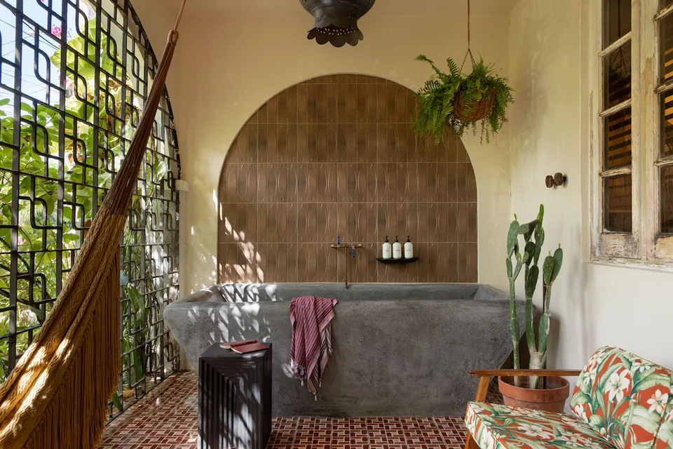 Private terrace, hammock and concrete soaking tub at Dreamcatcher’s Duna Suite