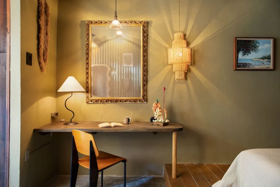 Vintage desk and warm lighting in the Poet Room
