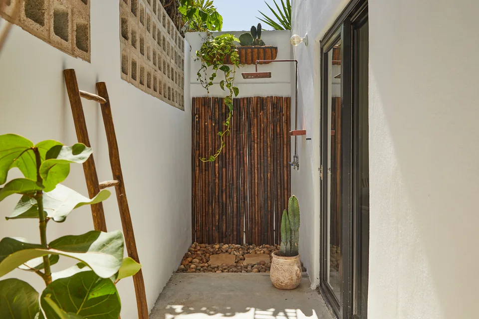 Plants, breeze blocks and an outdoor shower on Nomad’s wrap-around terrace
