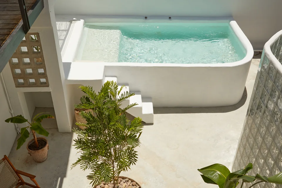 The shared saltwater pool seen from Duna’s courtyard steps