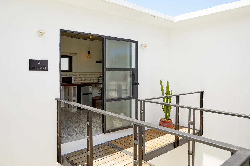 Traveler’s doorway and narrow Juliet balcony above the courtyard