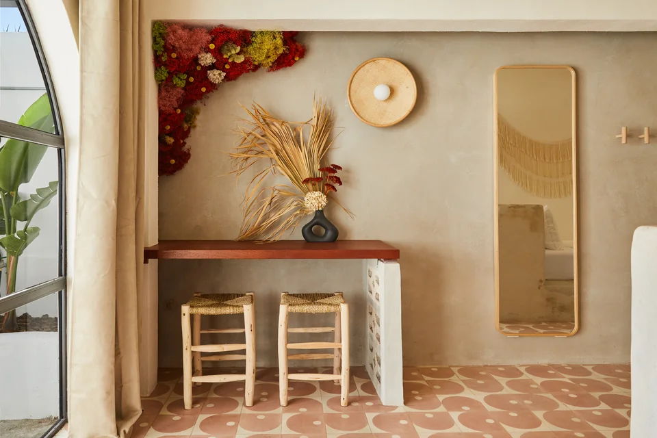 Florals and a small refreshment nook with mini fridge in Visionary