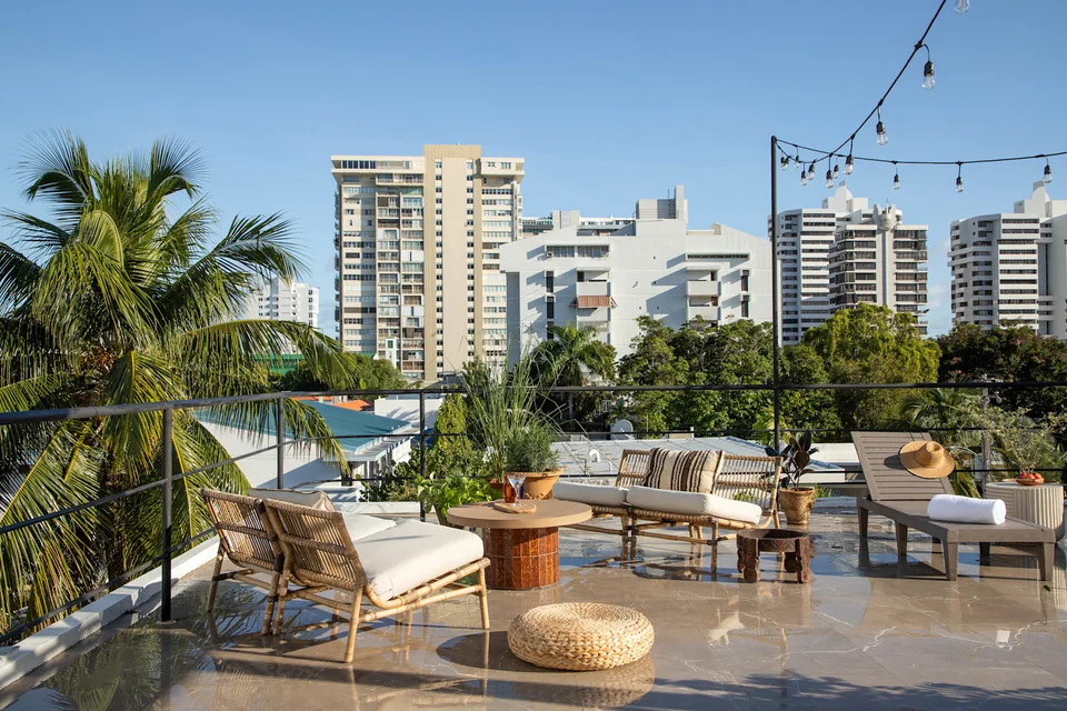 Lounge furniture and city views on Maru’s roof deck