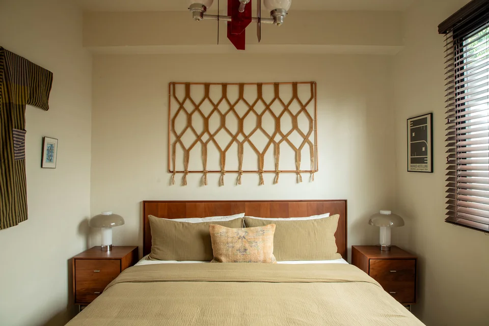 King bed and geometric timber headboard in RYO