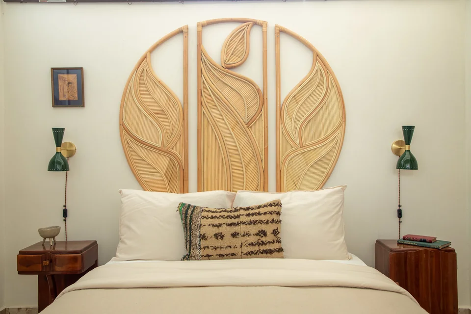 Queen bed and carved timber headboard in UMI