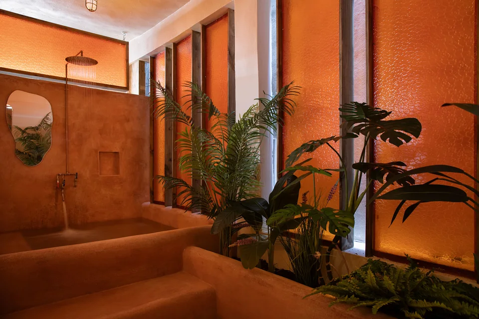 Enclosed terracotta soaking tub, shower and plants in A