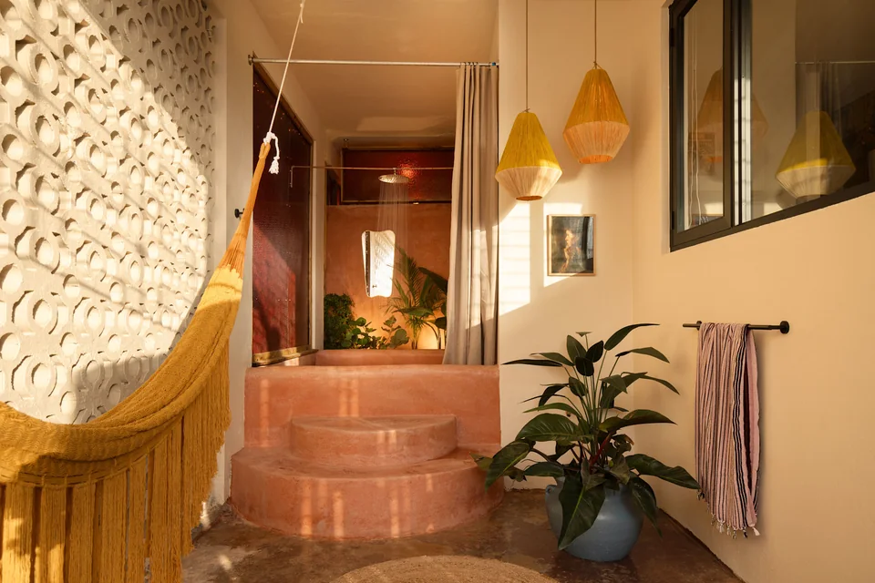 N’s terrace with a concrete soaking tub and geometric breeze blocks