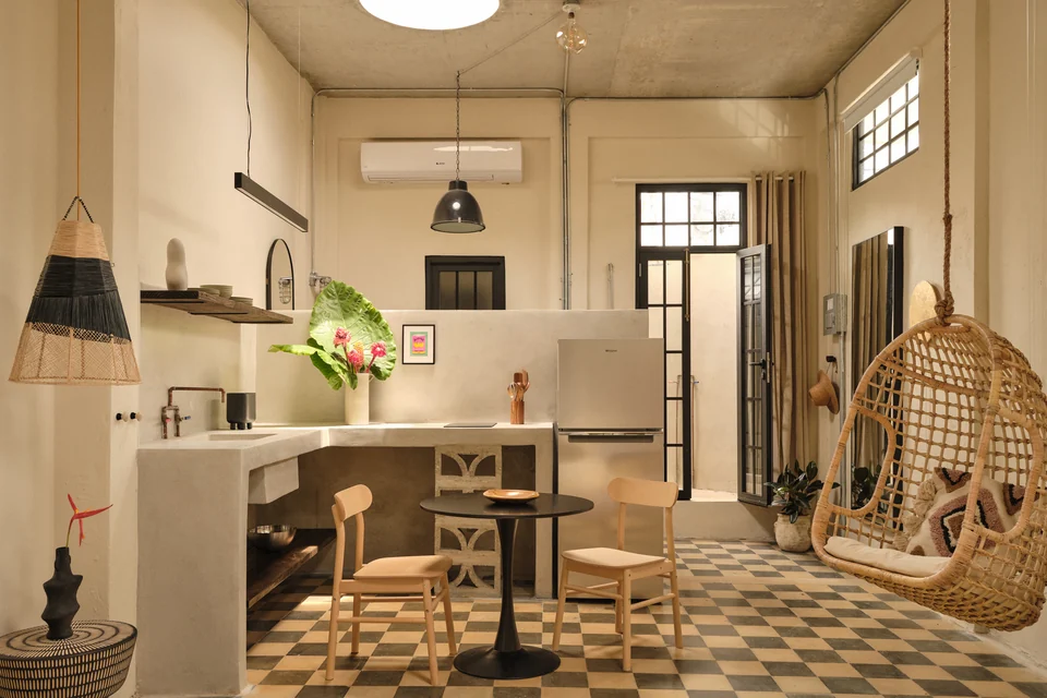 Paz 1’s kitchen, dining table and woven hanging chair