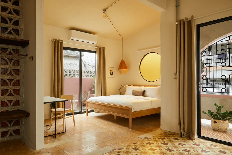 Rosa 1’s king bed, patterned floor and doors opening onto its private balcony