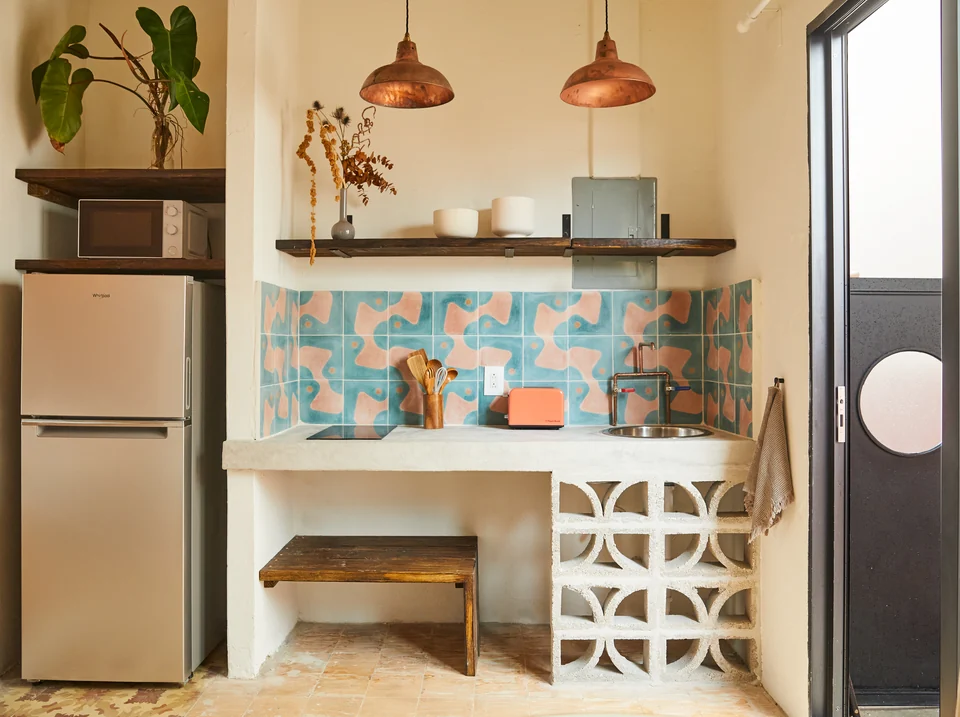 Copper pendants, floral tiles and a breakfast bar in Rosa 2’s kitchenette