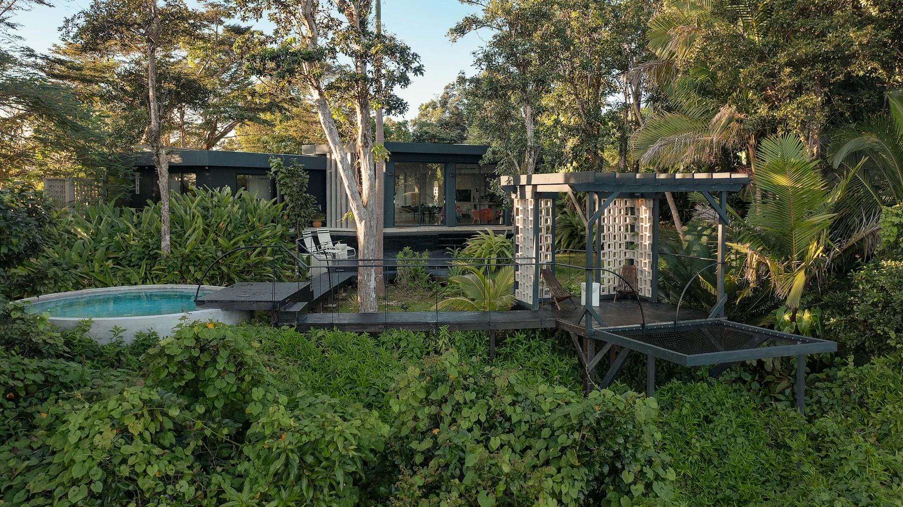 Selva’s whole house, deck and saltwater pool surrounded by rainforest