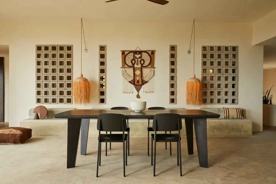 Custom dining furniture, woven pendants and open living space at Selva