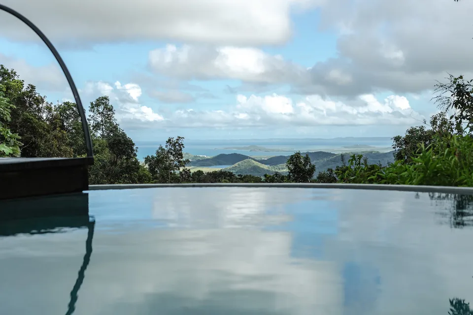 The edge of Selva’s saltwater pool overlooking the rainforest and distant coast