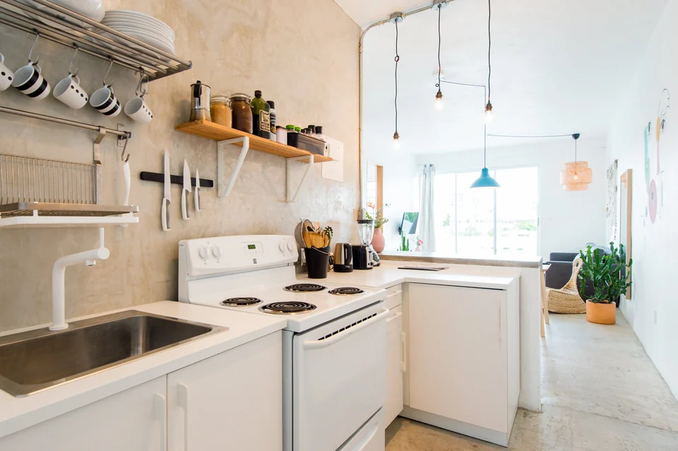 Dreamer’s full kitchen with oven, refrigerator and open shelves