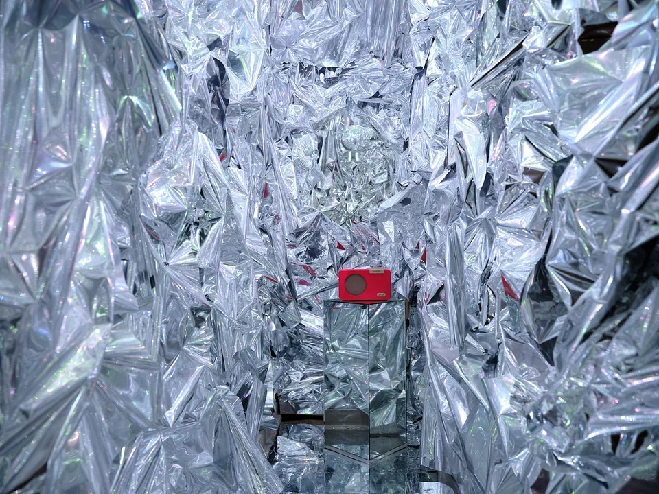 Silver walls and a red telephone in Verde’s hidden Factory-inspired room